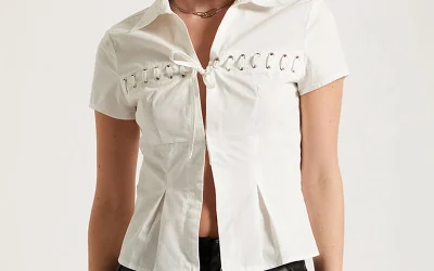 Woman wearing Third Charm Moxie lace tie front top with casual Y2K-inspired streetwear outfit styling