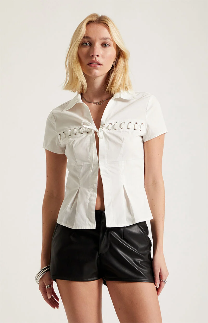 Woman wearing Third Charm Moxie lace tie front top with casual Y2K-inspired streetwear outfit styling