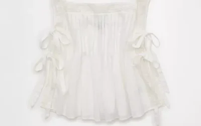 Woman wearing AE Side Tie Lace Trim Cami with casual feminine Y2K-inspired outfit styling