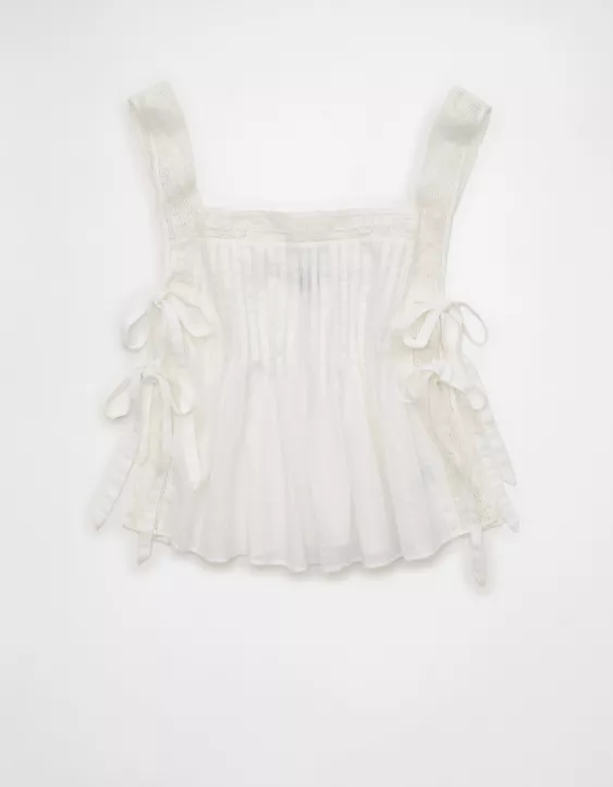 Woman wearing AE Side Tie Lace Trim Cami with casual feminine Y2K-inspired outfit styling